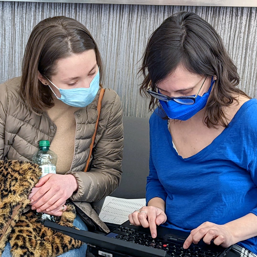 A Jewish Agency staffer helps a refugee with online immigration paperwork