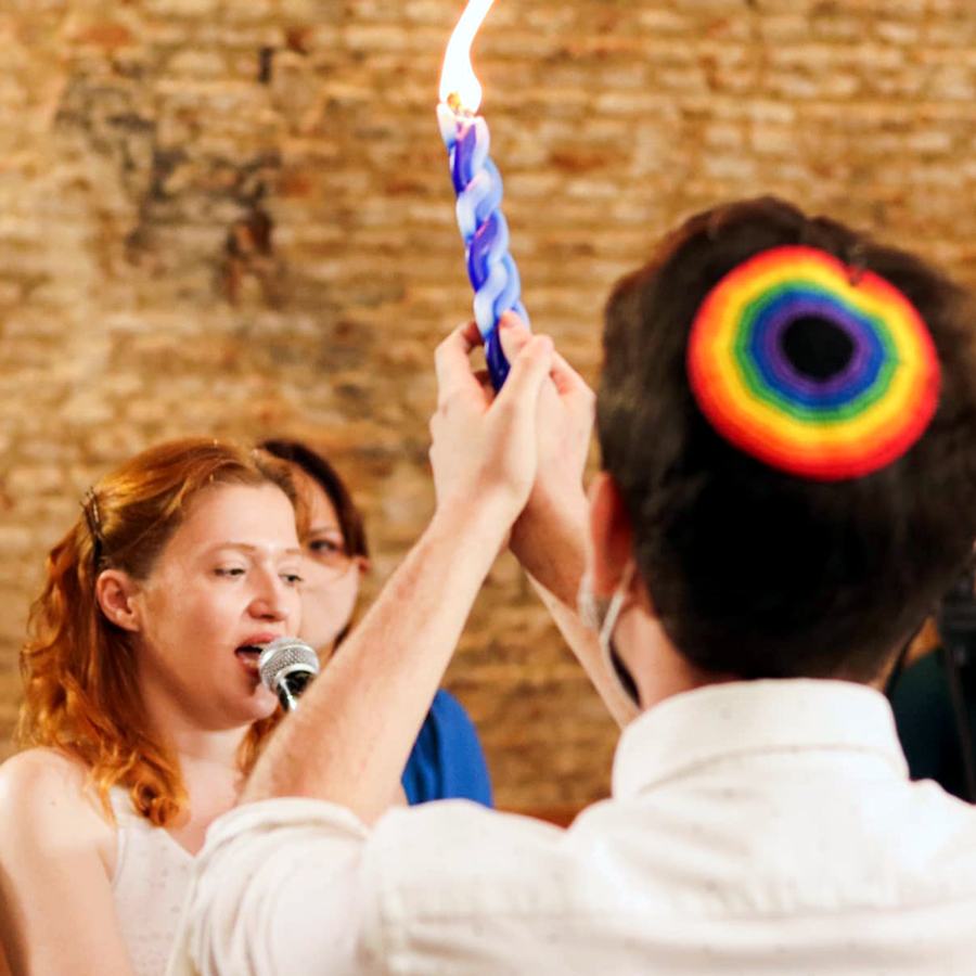 LGBTQ Jews at a Gaavah event hold a Havdalah candle