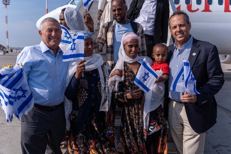 Doron Almog (left) and Mark Wilf with new Olim from Ethiopia at Ben Gurion Airport